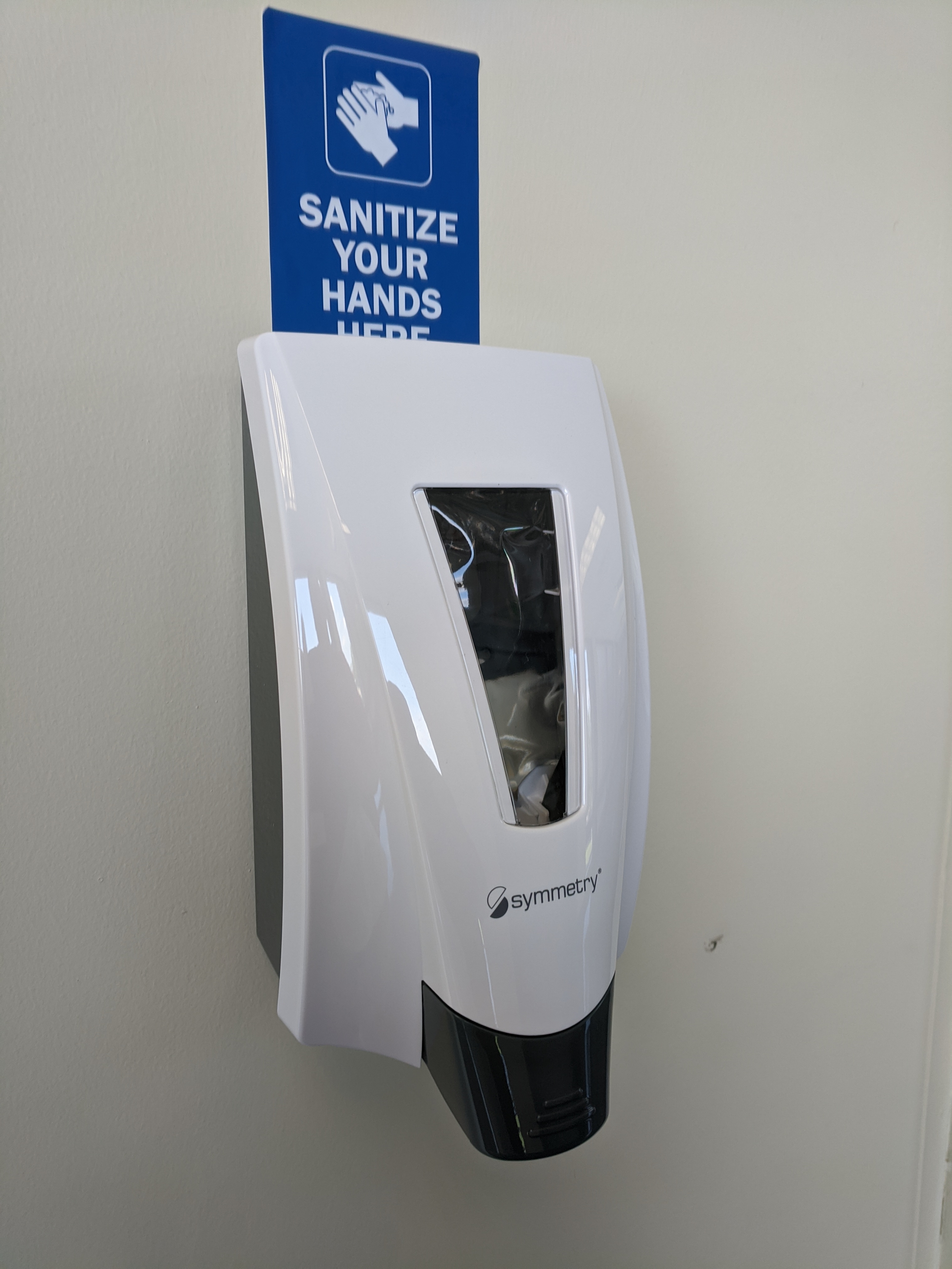 Wall mounted hand sanitizer station