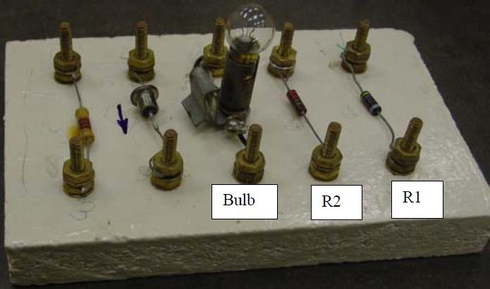 Board with diode, light bulb and resistors