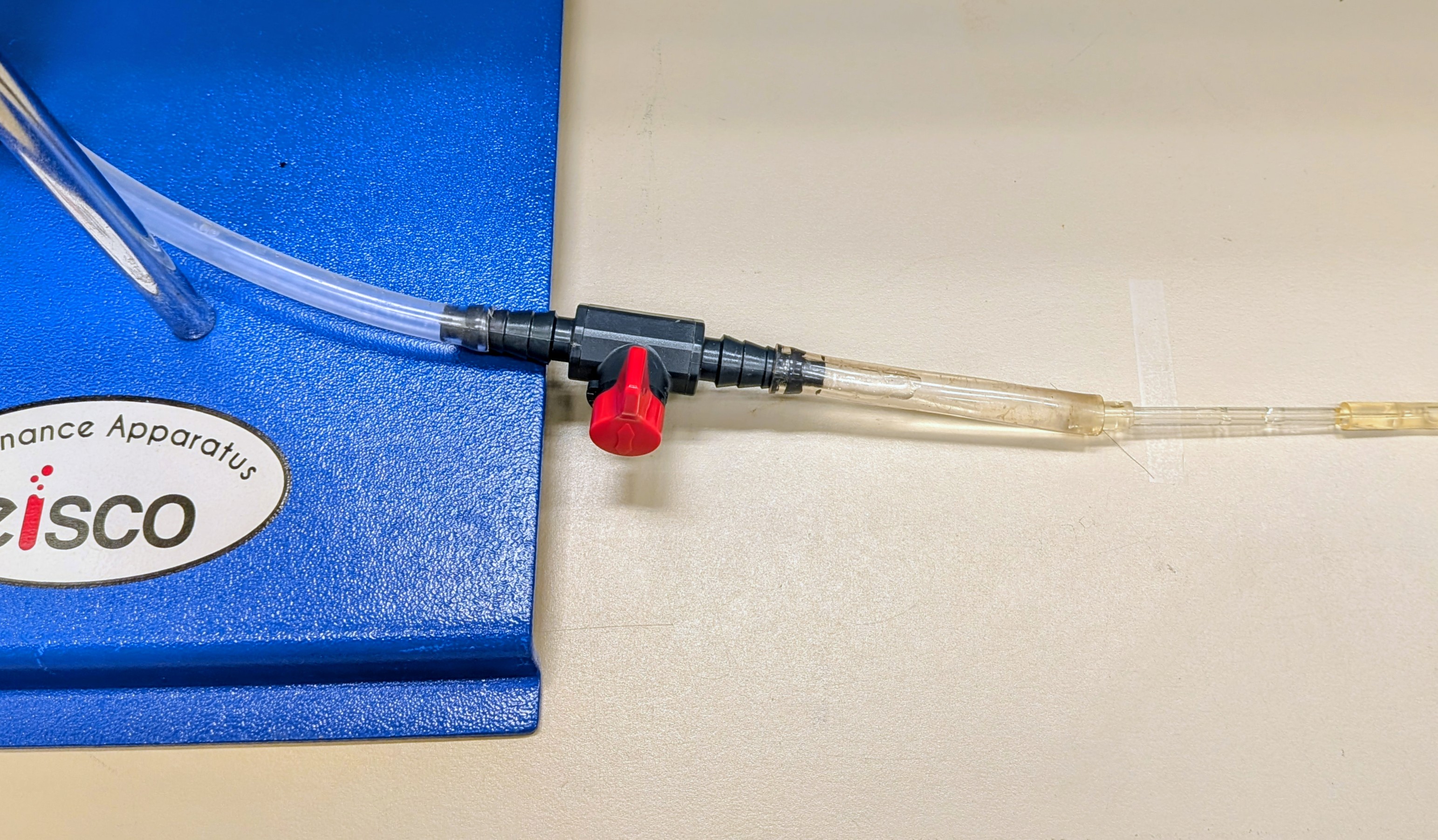 Apparatus for Poiseuille's Law, showing the narrow capillary which exhibits laminar flow.